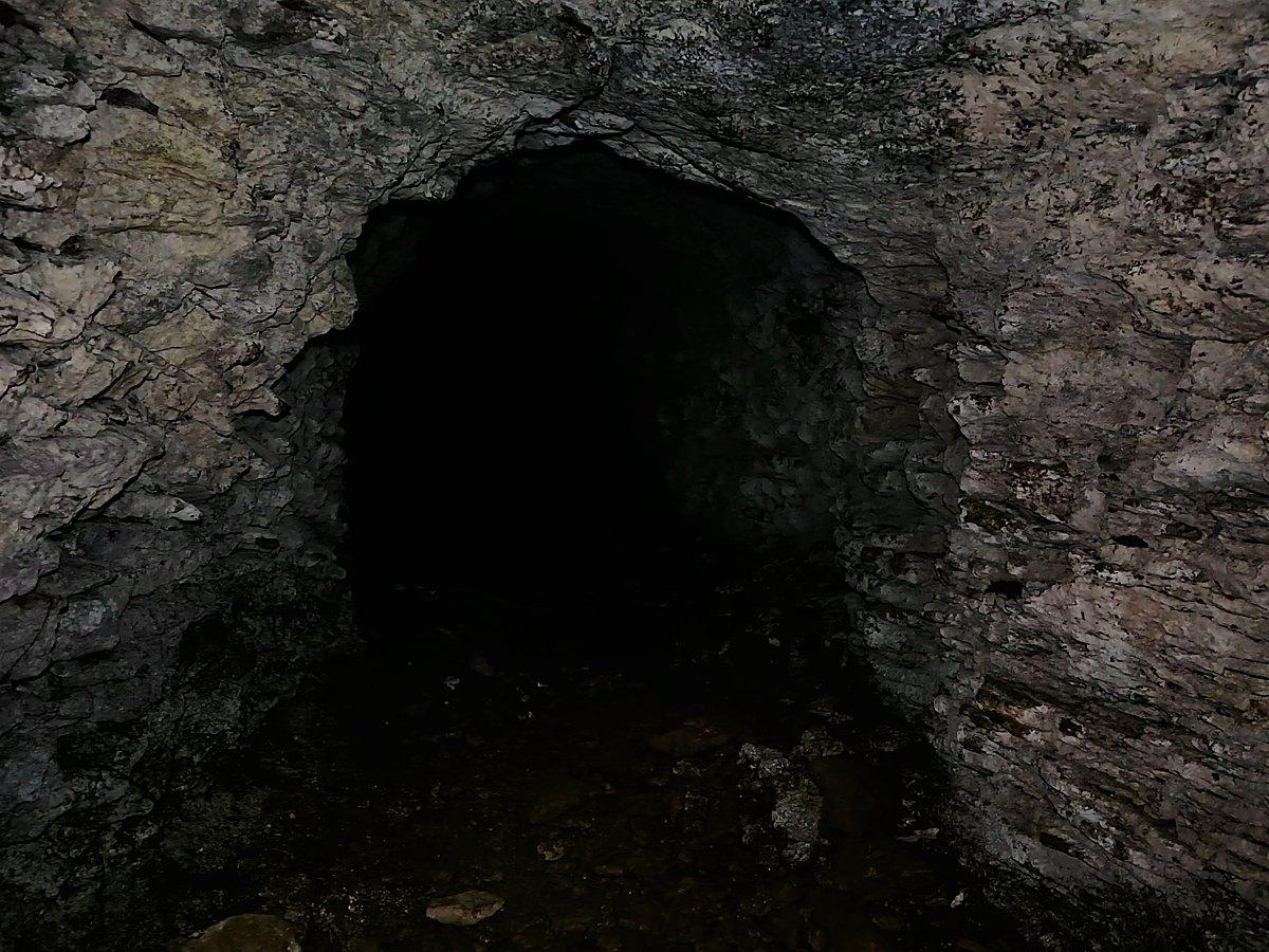 The mouth of a storage cave dynamited into the bare rock