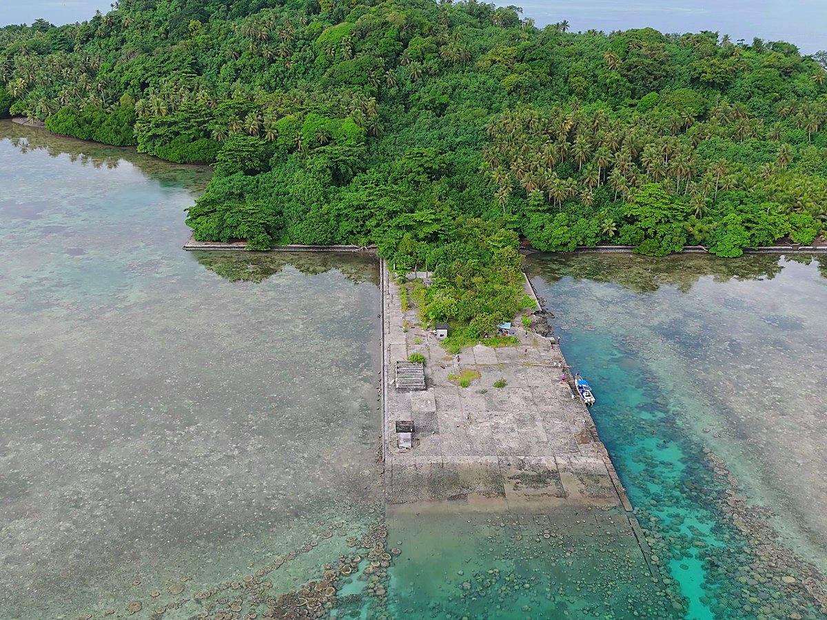 The seaplane ramp from the air — a concrete apron reaching from the jungle into the lagoon